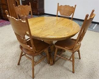 1055	CONTEMPORARY ROUND OAK TABLE W/4 PRESSED BACK OAK CHAIRS, 47 3/4 IN X 29 1/2 IN
