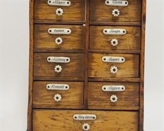 1063	HANGING WOODEN SPICE RACK, ALL ORIGINAL W/ALL KNOBS & LABELS, 9 7/8 IN WIDE X 11 5/8 IN HIGH X 3 3/8 IN DEEP
