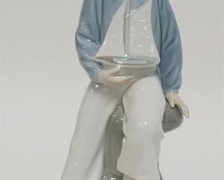1067	LLADRO SAILOR BOY HOLDING A SAILBOAT, 9 IN HIGH
