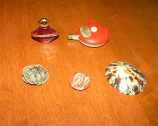 very small tortoise, tape measure, perfume, coca cola button and shell