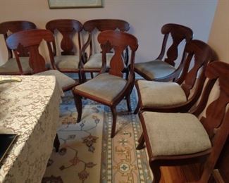 cherry upholstered dining chairs, one Captain's Chair, seven without arms