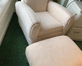 Beautiful Neutral Colored Upholstered Chair and Ottoman in "linen". Addition notes on the furniture tag, note a "Delray finish" and "9070 Linen." Arm to arm it measures 29.5" and the seat measures 20" x 18" and the ottoman (has two small stains) measures 28" x 19" x 15".  This lovely chair could be used as a great accent piece to any room in your house; a bedroom, office, or living room and more! 