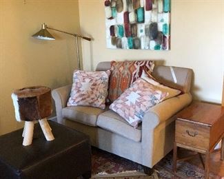 Love seat with fun painting and ottoman