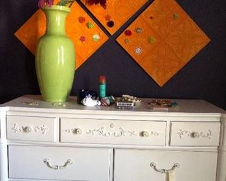 white chest of drawers with a tozai vase