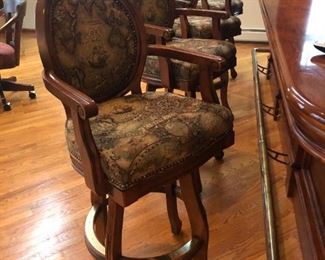 4 bar stools; solid wood, nail head trim cushion&nbsp;seat and back,&nbsp;brass footrest and swivel.                        
