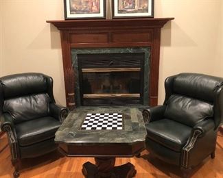 Bradington Young leather reclining wing chairs.       
Butler Specialty marble top game table.