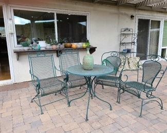 Wrought Iron table with  4 rocking chairs