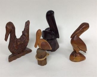 Collection of wood carved pelicans 