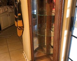 Corner bow front china cabinet w/glass shelves & light