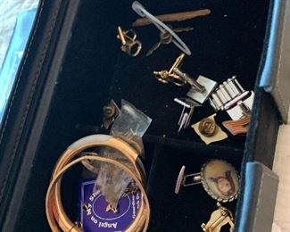 small selection of cuff links and jewelry