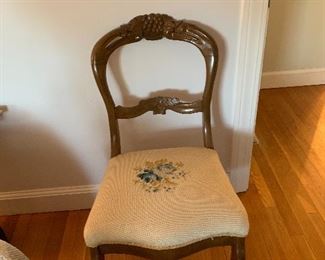 Carved back side chair with needlepoint seat