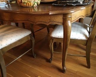 Oak dining table with two leaves, 58”.           There are Extra  leaves