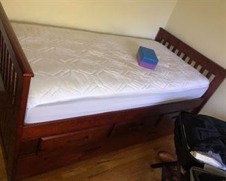 Twin bed with drawers and a pullout bed on the bottom