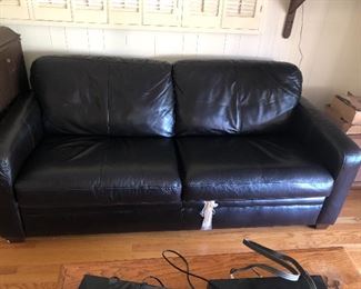 Black vinyl fold out sleeper sofa, barely used, been in storage 