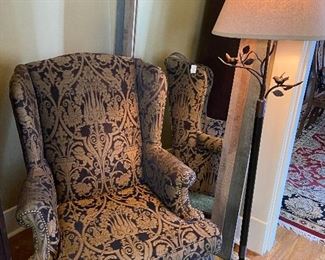 Updated wing back chair, huge framed mirror and metal floor lamp with birds and branches.