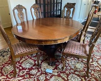 Large dining table with 3 leaves.  6 wooden dining chairs.