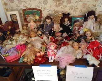 Entire Table of Barbie Dolls and Porcelain dolls. $50