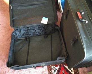 Both large suitcases with rollers $20 for pair