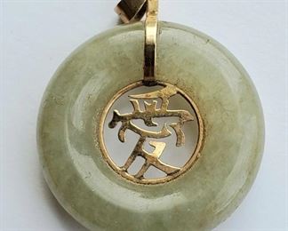 14k gold and jade donut pendant. Chinese character for "Love"
