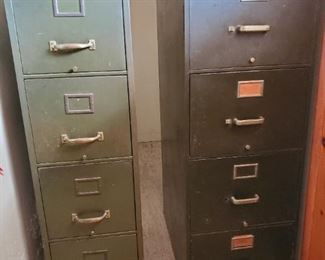 2 four drawer metal file cabinets