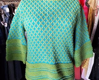 Classic teal and avocado green 1960s sweater. Groovy!