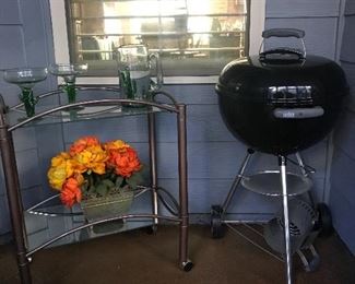 Webber grill - never used and comes with cover.  Nice bar cart!!