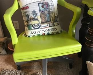 Vintage desk chair with a fun pop of color.  Tons of neat throw pillows all over the house.  