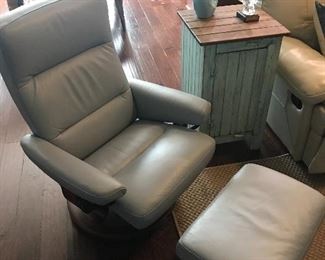 Like new Stressless light blue modern leather chair and foot rest. Very comfortable and stylish piece.