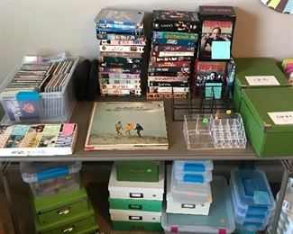 We have records, dvds, vhs tapes, CDs, and several storage boxes and organizational items of many colors, shapes and sizes.