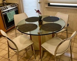 Vintage glasstop table & Chrome chairs by Design Within Reach