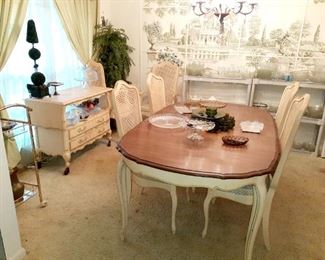 Nice french style dining room suite.  Dining table with 6 chairs, 2 leaves, side serving cart and china cabinet.