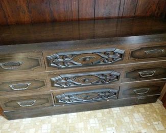 https://ctbids.com/#!/description/share/719334 Vintage wooden dresser. Measures 62"x17"x32" Not all drawers slide smoothly and one drawer pull is broken as noted in last photo.

