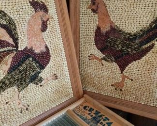 https://ctbids.com/#!/description/share/719387 This is a cleverly created rooster and hen set. Each piece measures 28" by 22" and they are done with different kinds of beans and seeds. Unfortunately some of the beans and seeds have been picked off, however the artwork is still fabulous. This lot comes with a Crystal Cascade washboard that measures 24"x12".

