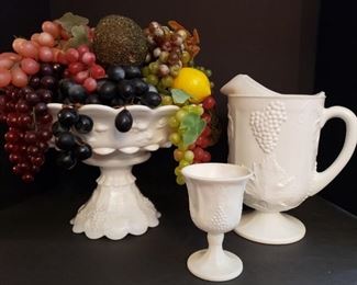 https://ctbids.com/#!/description/share/719424 3 pieces of beautiful white glass with embossed grape design. Bowl on stand filled with plastic fruit measures 14"H x 12"L, pitcher measures 11"H x 8"L and cup measures 5 1/2"H x 3"L.
