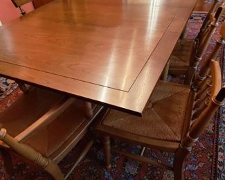 https://ctbids.com/#!/description/share/719476 Thomasville Rural English collection walnut dining room table and 6 chairs. Rush seat chair set includes 4 side chairs and 2 arm chairs. Table has extra leaf that is not currently in table and measures 24”.

Folding dining table measures 72"L x 29"H x 44"W. Six chairs measure 33 1/2"H x 21"L x 24"W.