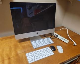 https://ctbids.com/#!/description/share/719382 The iMac computer sits 18" tall and 21" across. The screen is a 21" screen diagonally. There are two cordless keyboards, one apple mouse and one small black mouse. Computer powers on but not working.

