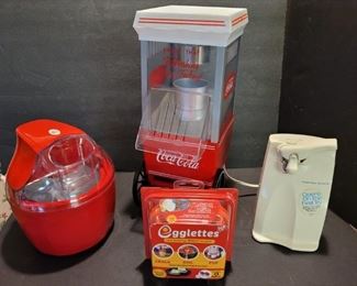 https://ctbids.com/#!/description/share/719454 Hamilton Beach electric can opener, Coca Cola popcorn machine is 17" tall, 9" x 7" wide. Ice cream maker is 9" tall. The egglettes are unopened but there are 4 in this pack.

