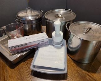 https://ctbids.com/#!/description/share/719453 Largest pot is 9" deep and 12" wide. The strainer pot is 8" deep and 10" wide. The small chopper is 8" tall. There are also two covered baking pans, electric knife and more.

