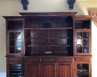 Available for presale! Text (708)846-0259 to inquire. Stunning Walter E Smithe entertainment center with hidden pop up compartment for TV