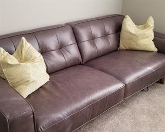 This "Modani" sofa is grey and in prefect condition.