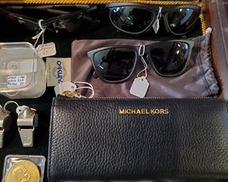 Like new, Michael Kors 3/4 zip wallet.  Oakley sunglasses.