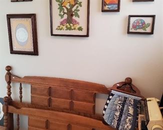 Nice maple double bed (no mattress).  Great cross stich pictures throughout.