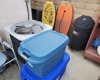 Vintage boogie boards.  Small Weber barbeque.