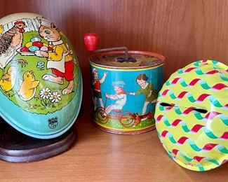 Item 199a:  Vintage collectible J. Chien Tin Lithograph Easter Egg Candy Holder, 1930s: $65                                                                 Item 199b.:  Vintage Tin Noise Maker with Tricycle Scene: $15                                                                                                         Item 199c.: Vintage Tin Noise Maker, Yellow: $12
