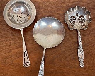 Item 132:  American Sterling Tea Strainer (Left):  $38                  Item 133:  Sterling Bon Bon Spoon (Middle):  $65  SOLD                                                                   Item 134:  Sterling Bon Bon Spoon (Right):  $40