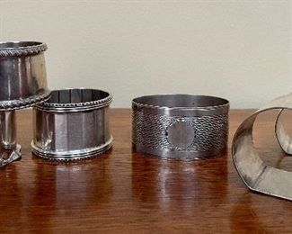 Item 107:  (6) Sterling Napkin Rings: $160  