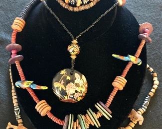 Item 167:  Lot with Wooden Animal Necklace: $28