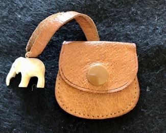 Item 177:  Tiny carved elephant with little purse: $18