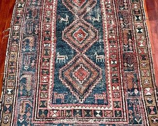 Item 411:  Antique - quite worn, hand knotted rug with animals - 43" x 68":  $245