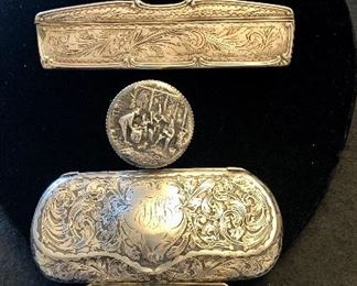 Item 440:  Sterling Belt Buckle (top):  $45                                                        Item 441:  Antique Sterling & Tortoise Shell Comb (2nd from top):  $75                                                                                                     Item 442:  Vintage Sterling Pill Box (3rd from top):  $38                                                                                                       
Item 443:  Antique Sterling Eyeglass Case (4th from top):  $125                                                                                                          Item 444:  Sterling Eyeglass Case & Glasses (bottom):  $150